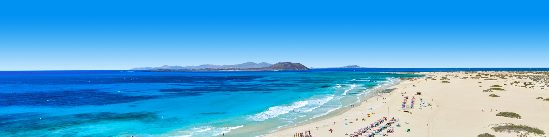 Strand waar je bijkomt tijdens last minute vakantie Corralejo 