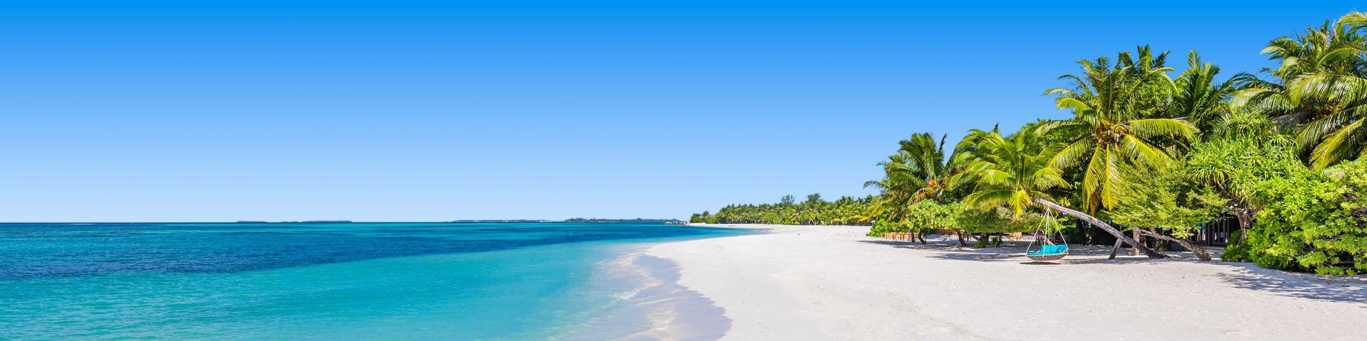 Genieten op een wit zandstrand tijdens een strandvakantie!