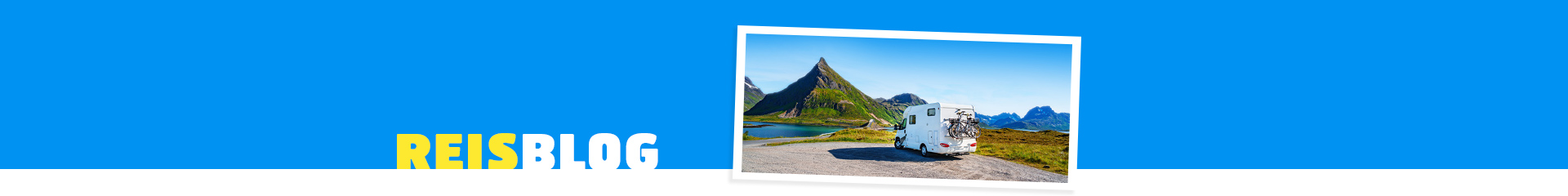 Camper, met daaromheen prachtig groen landschap en een blauw meer! 